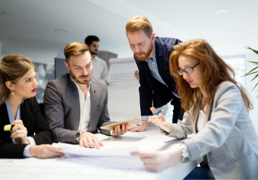 business-people-working-together-on-project-and-B3MZ4TX